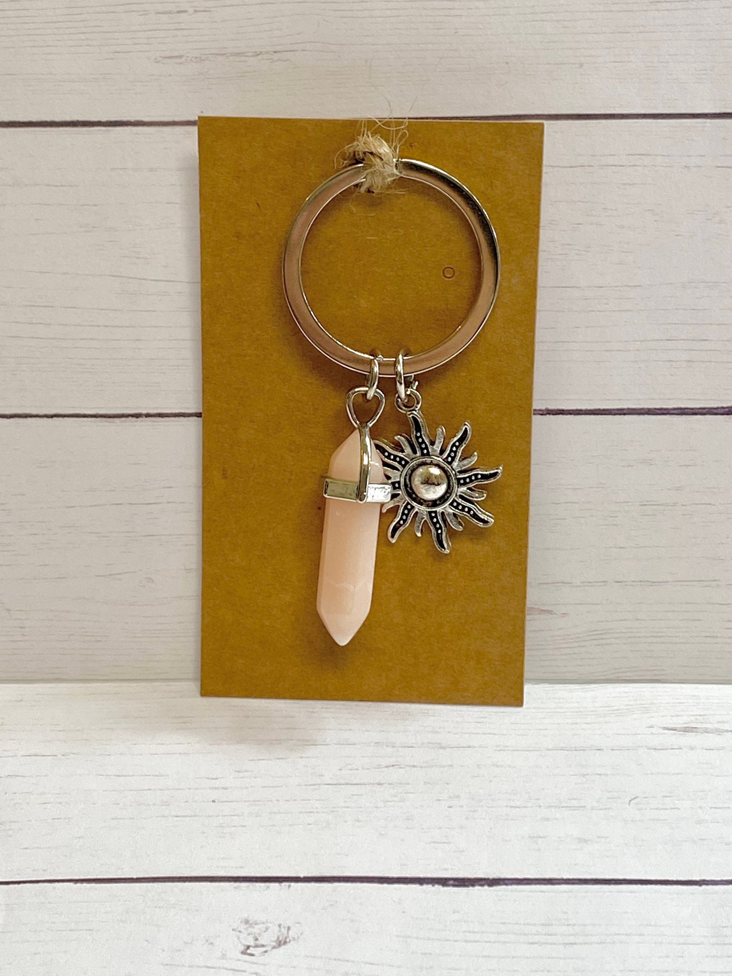 Pink crystal inspired resin keychain with sun charm